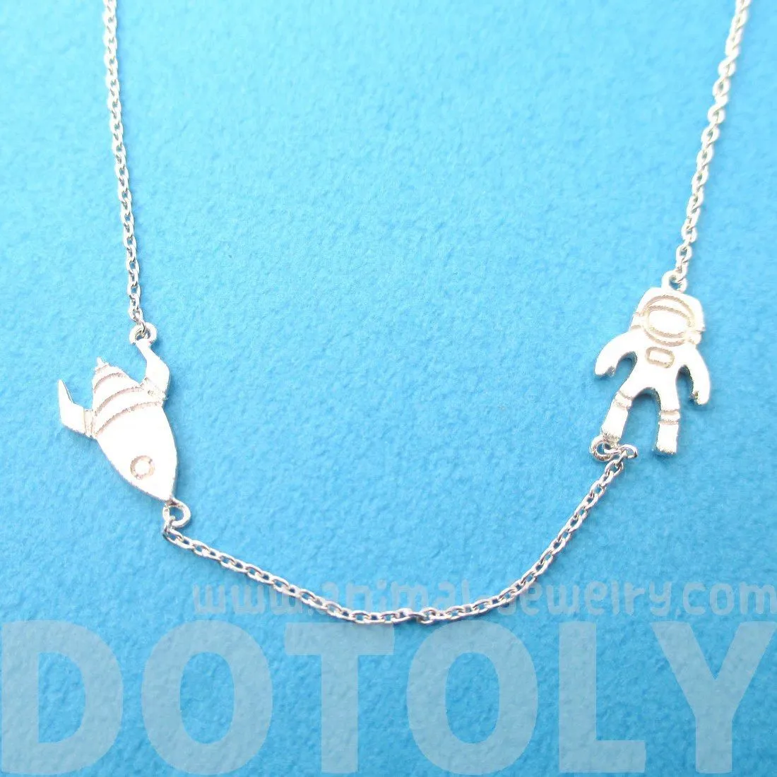 Spaceship and Astronaut Space Travel Themed Charm Necklace in Silver | DOTOLY